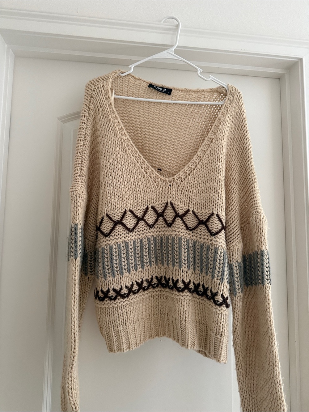 Cream V-Neck Knit Sweater with Contrast Stitching